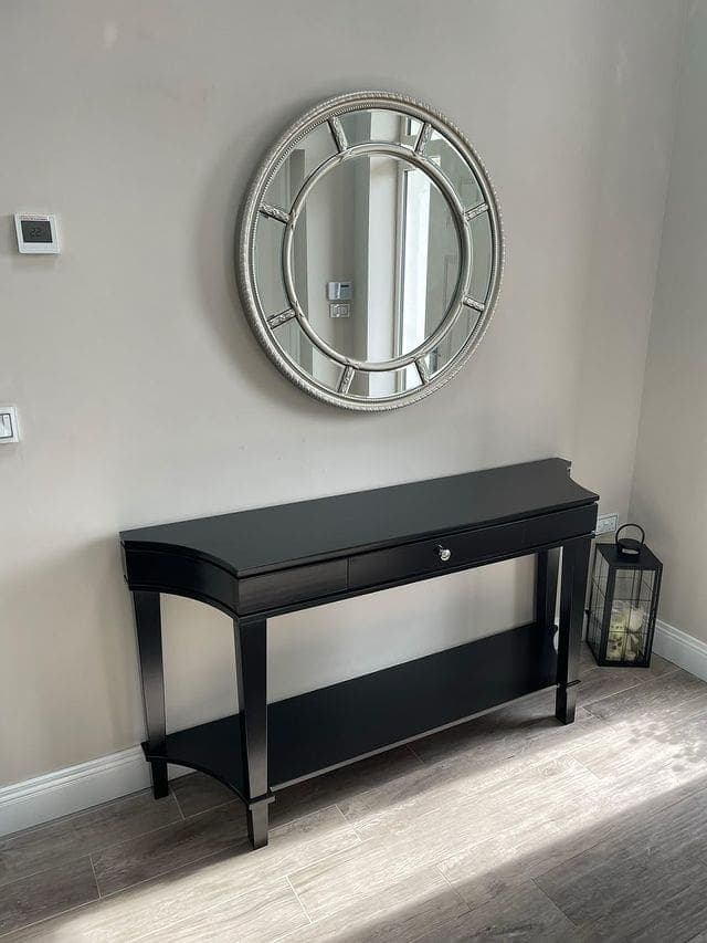 Curved black console table