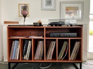 Teak stereo cabinet on black metal legs