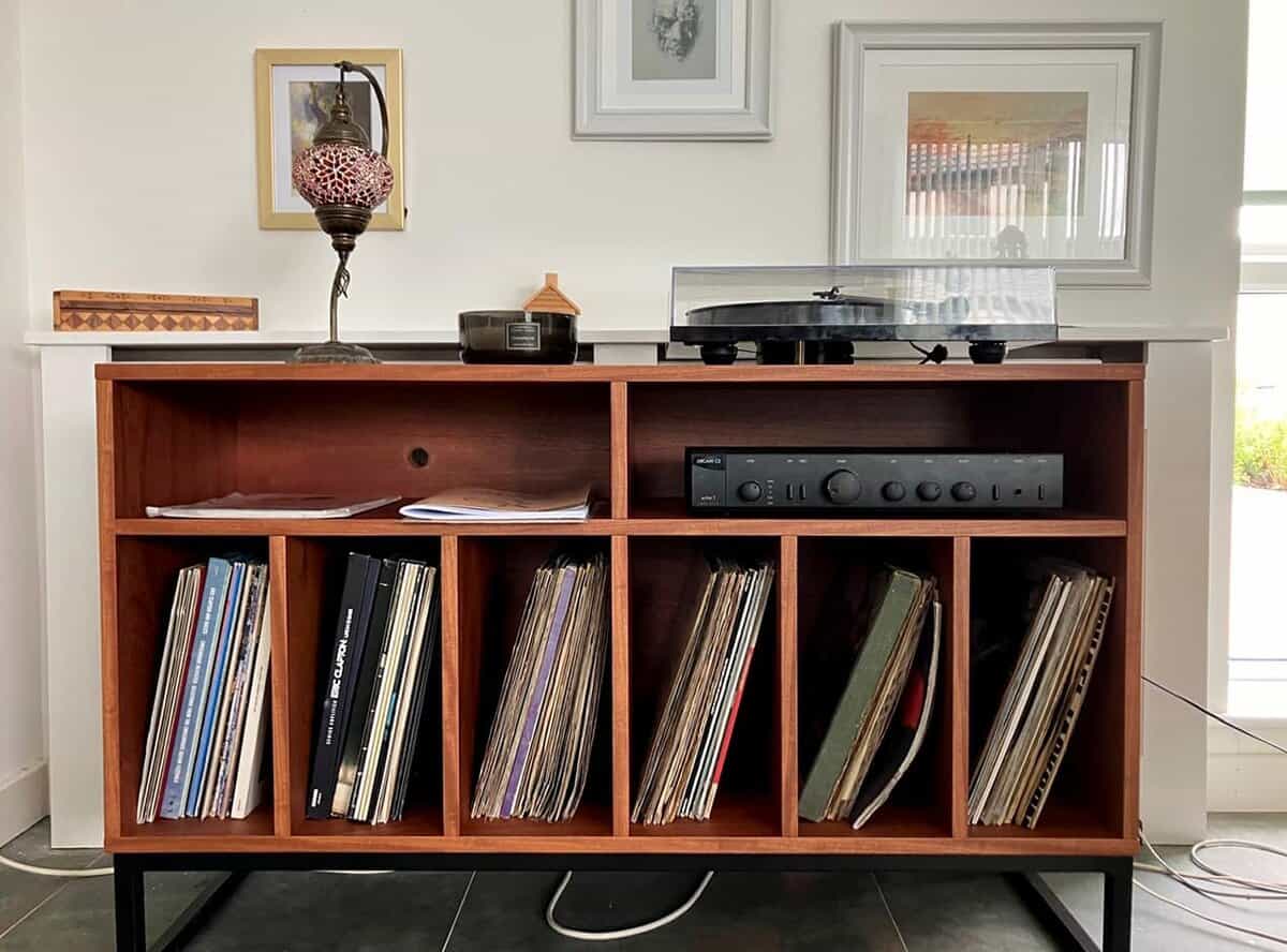 Teak stereo cabinet on black metal legs