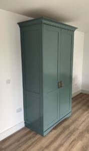painted kitchen unit with copper handles