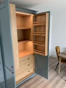 Kitchen larder showing integrated lighting