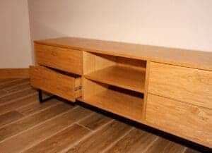 Oak TV unit with open drawer