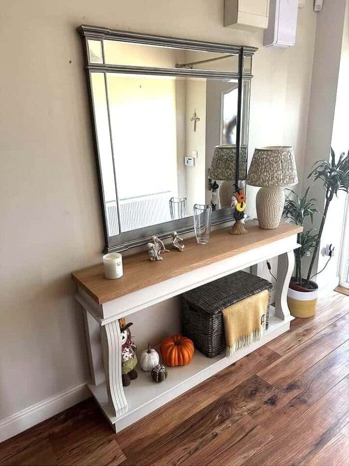 Oak console table under a mirror