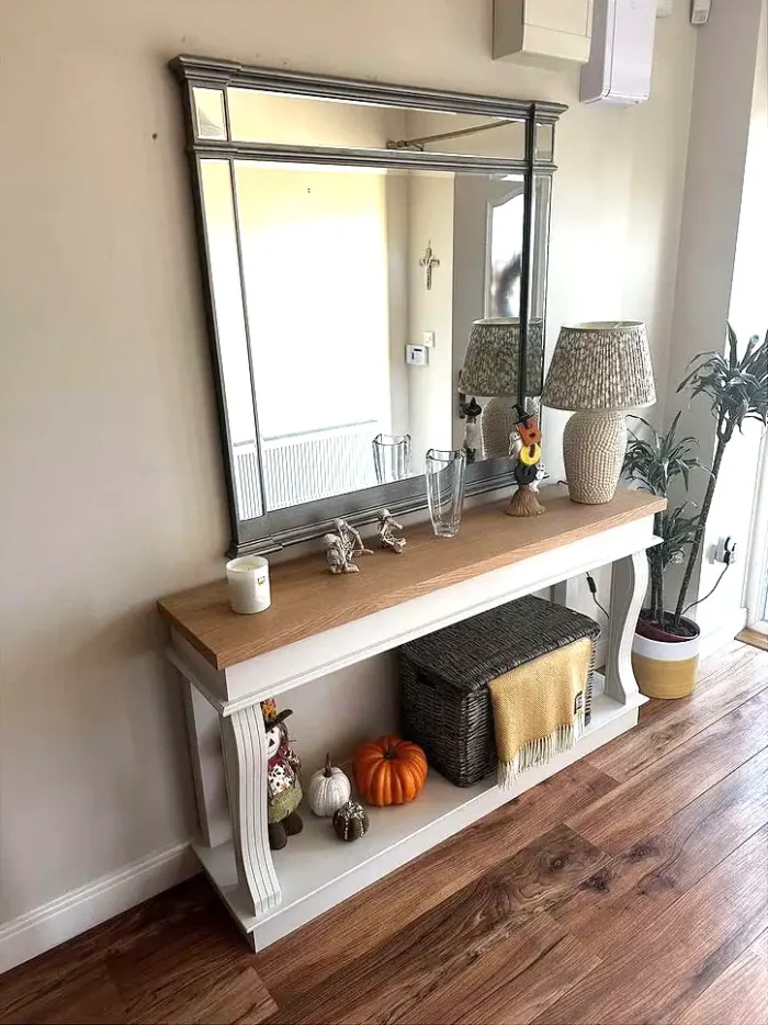 Oak console table with decorations