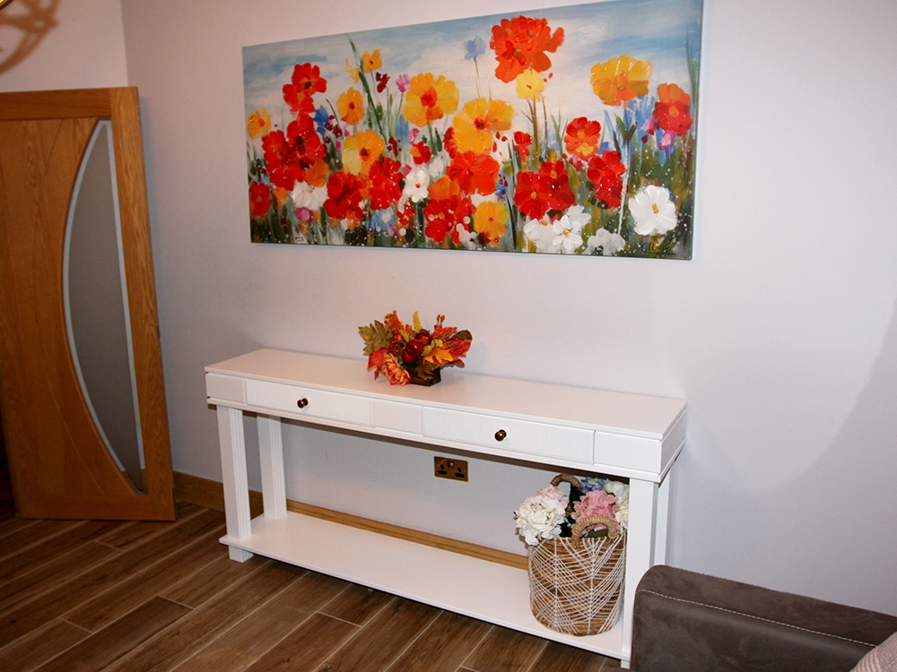 White console table with two drawers and a lower shelf