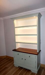 Mid-century modern kitchen dresser with integrated lighting on open shelving